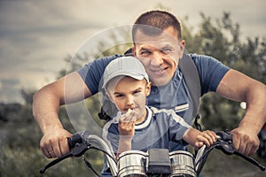 Father son riding motorcycle lifestyle biker portrait concept happy paternity fatherÃ¢â¬â¢s day photo